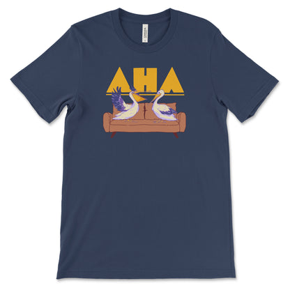 A digital mockup of a navy tshirt featuring a design of two pelicans on a couch. One wears glasses and has its wings spread as if gesturing. The Ask Hank Anything logo is behind them.