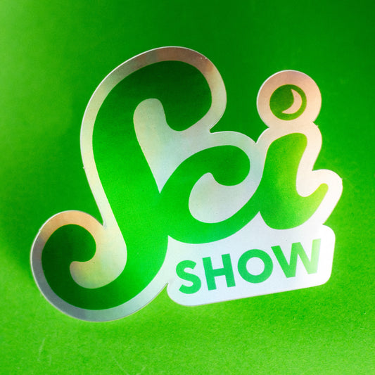 A photo of a holographic sticker of the SciShow logo on a green background